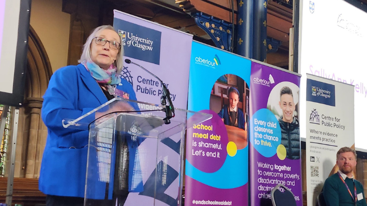 A photo of SallyAnn Kelly speaking at the event