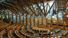 A photo of the inside of the Scottish Parliament chamber