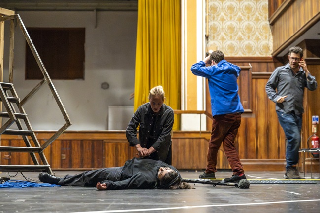 Panic on set after a trailing cable leads to an accident occurring in the final scene of the Set Ready Safety immersive training programme. Actors: Isobel Moorhouse, Victoria Giambalvo, Jack Hunter and Dave Gerow Credit. Tim Anger