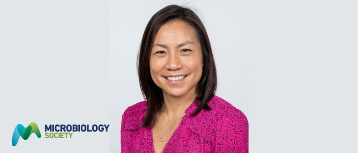 Headshot of Antonia Ho in a pink top.
