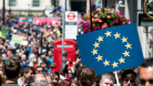 A person carries a EU flag sign in London, UK