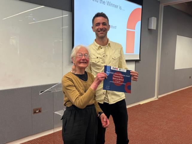 Judy Wilkinson and Alasdair Clark with the JWNC Chris Wilkinson Award certificate