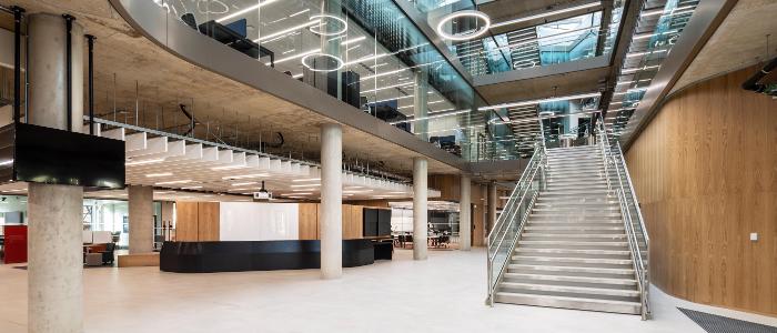 Interior of the ARC Atrium facing the glass stars and reception desk 